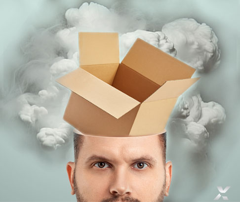 Un montage photo d'une tête d'un homme avec une boîte qui en sort.